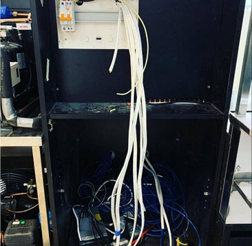 Three-phase switchboard wiring inside an industrial enclosure
